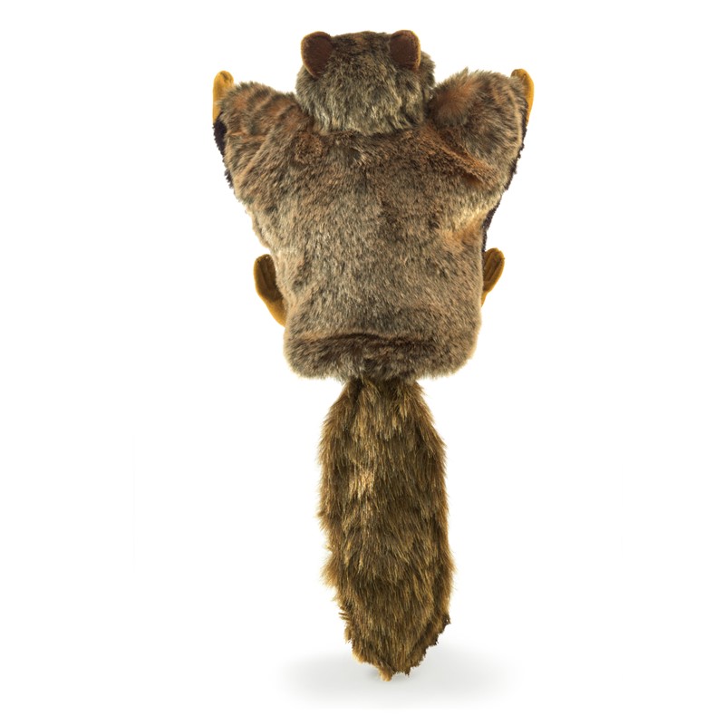 Folkmanis flying squirrel hand puppet seen from behind, with brown-grey patterned fur, a long bushy tail and outstretched gliding membranes