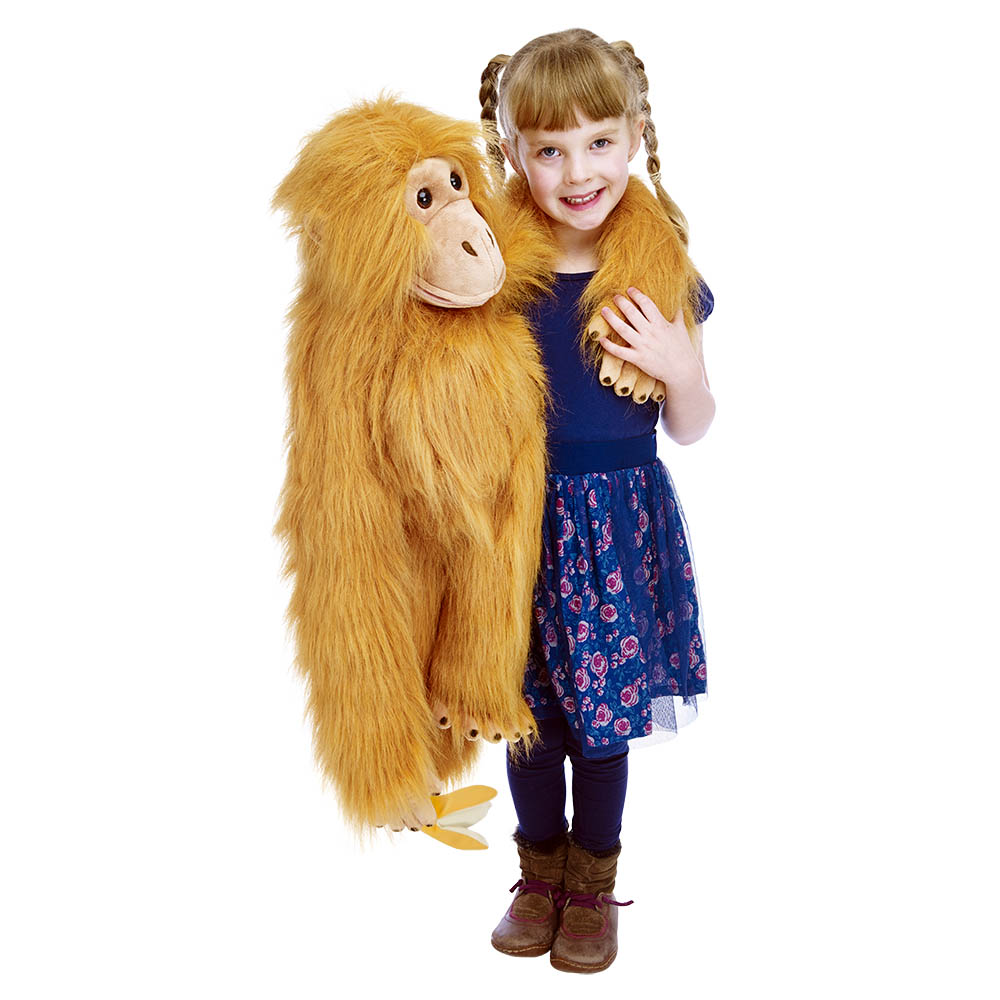 Girl hugging the The Puppet Company giant orangutan hand puppet, usage example