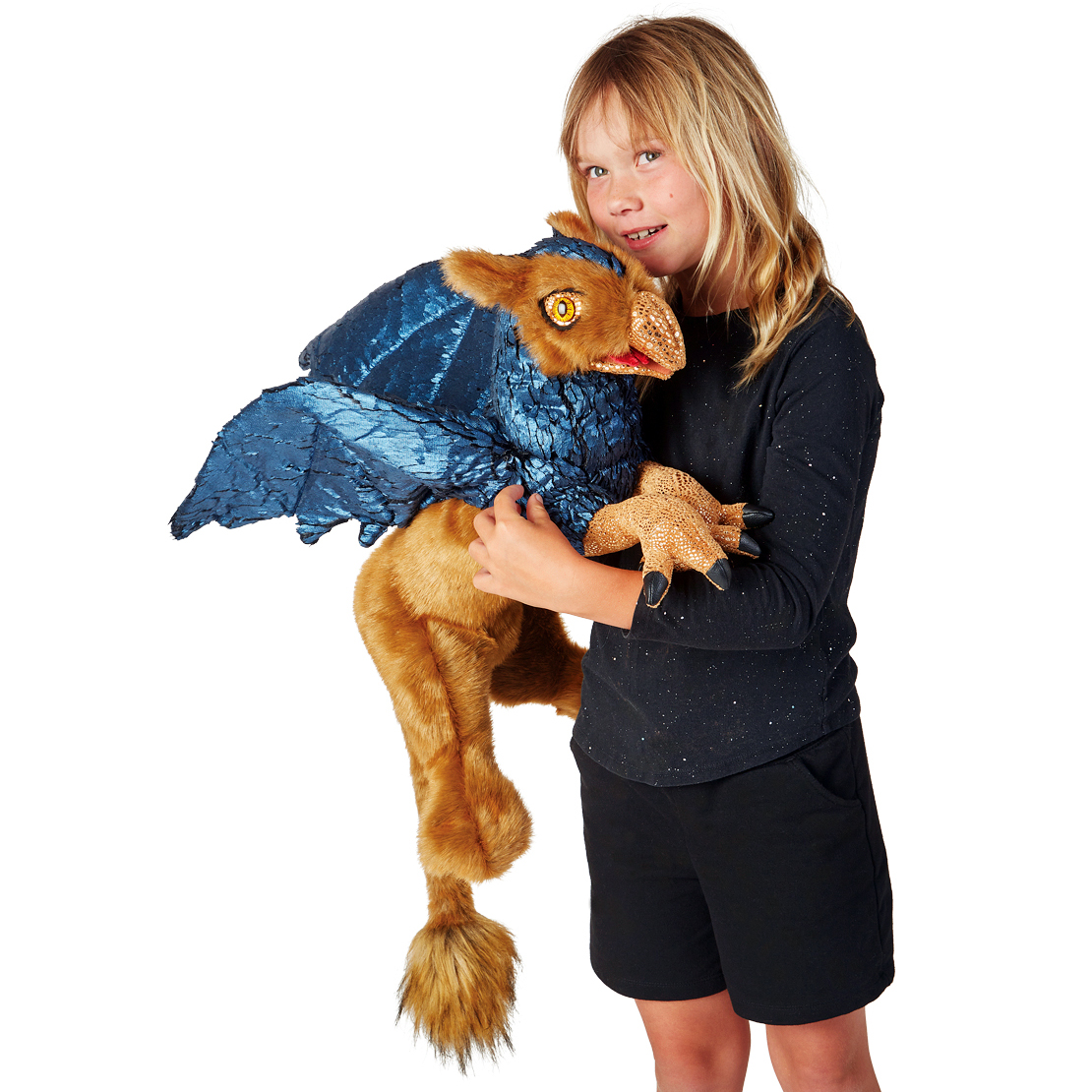 Folkmanis hand puppet griffin with blue metallic wings and reddish-brown fur, held in the arms of a child
