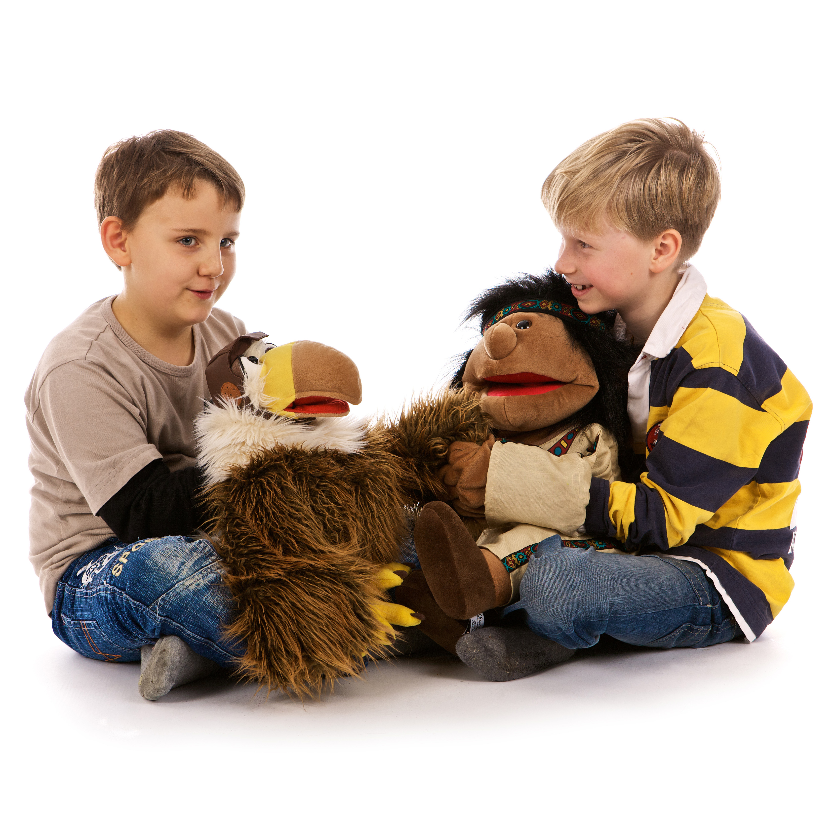 Two children playing with the Living Puppets hand puppets Heiko the eagle and a monkey