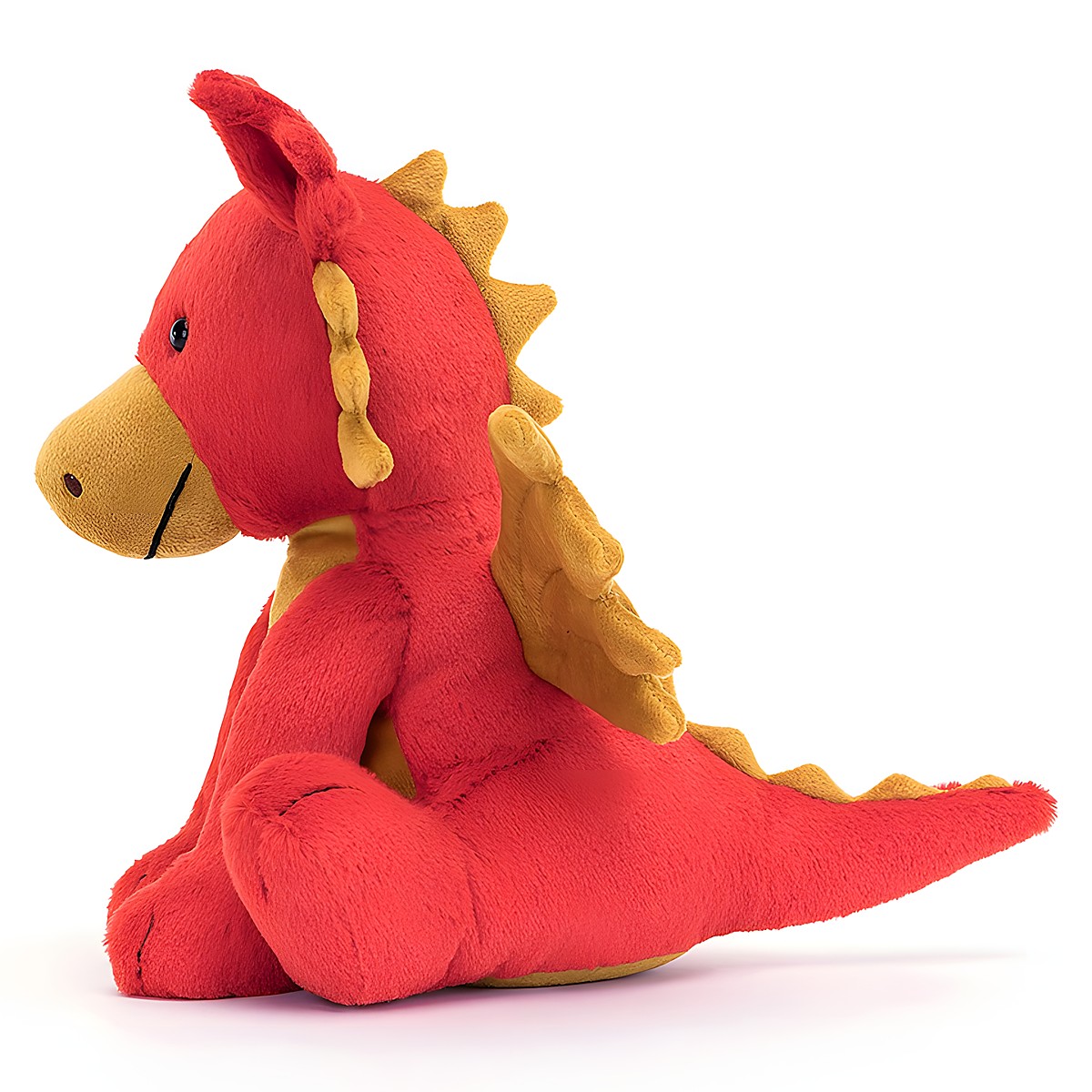 Jellycat plush toy dragon Darvin, red plush toy with golden wings, sitting, side view
