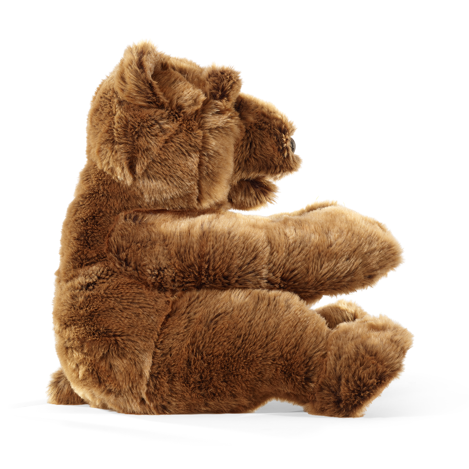 Folkmanis large bear hand puppet seen side-on, with its paw raised and mouth open to show the pink tongue.
