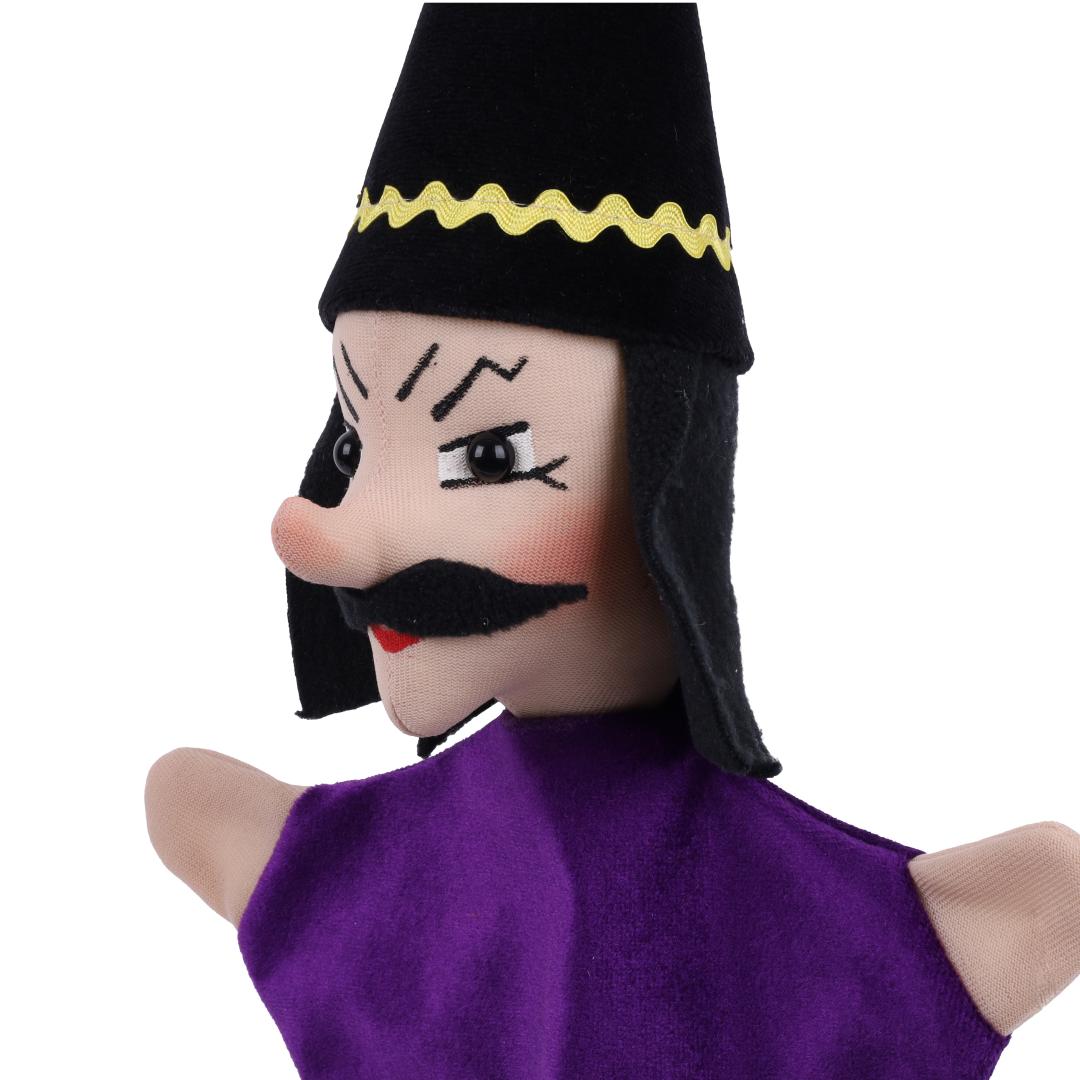 Magician hand puppet by munabo, close-up of the face with slanted eyebrows and a black moustache.
