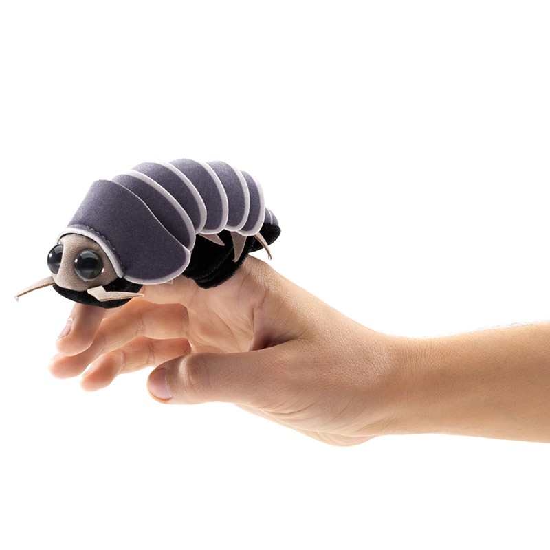 Folkmanis mini roly poly finger puppet in grey on a hand, side view showing segmented shell and large glass eyes