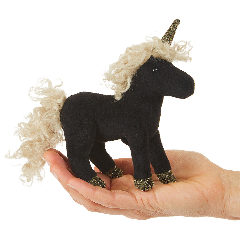 Folkmanis mini black unicorn finger puppet with creamy curly mane, gold glitter horn and hooves, standing on a palm