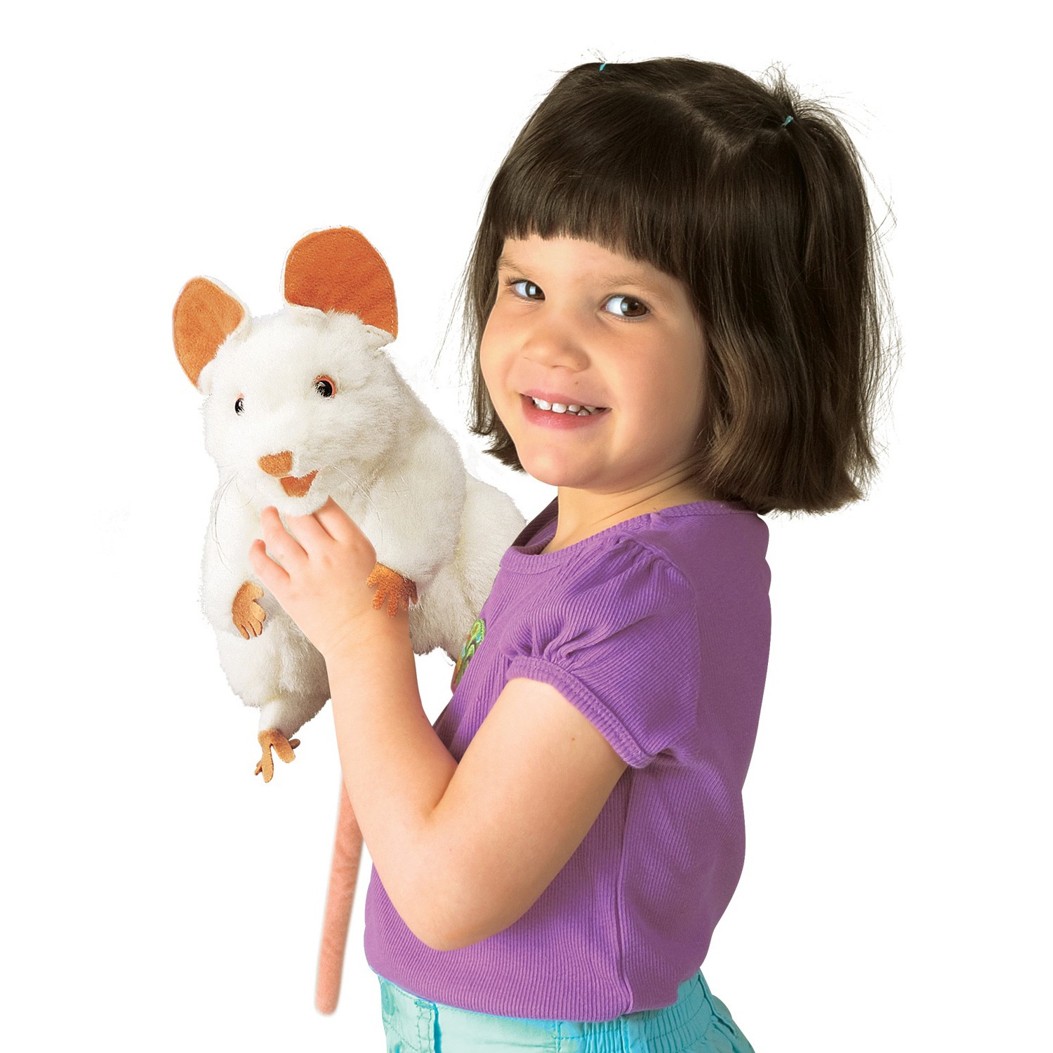 Smiling girl holding up a Folkmanis white mouse hand puppet with brown ears and a long pink tail