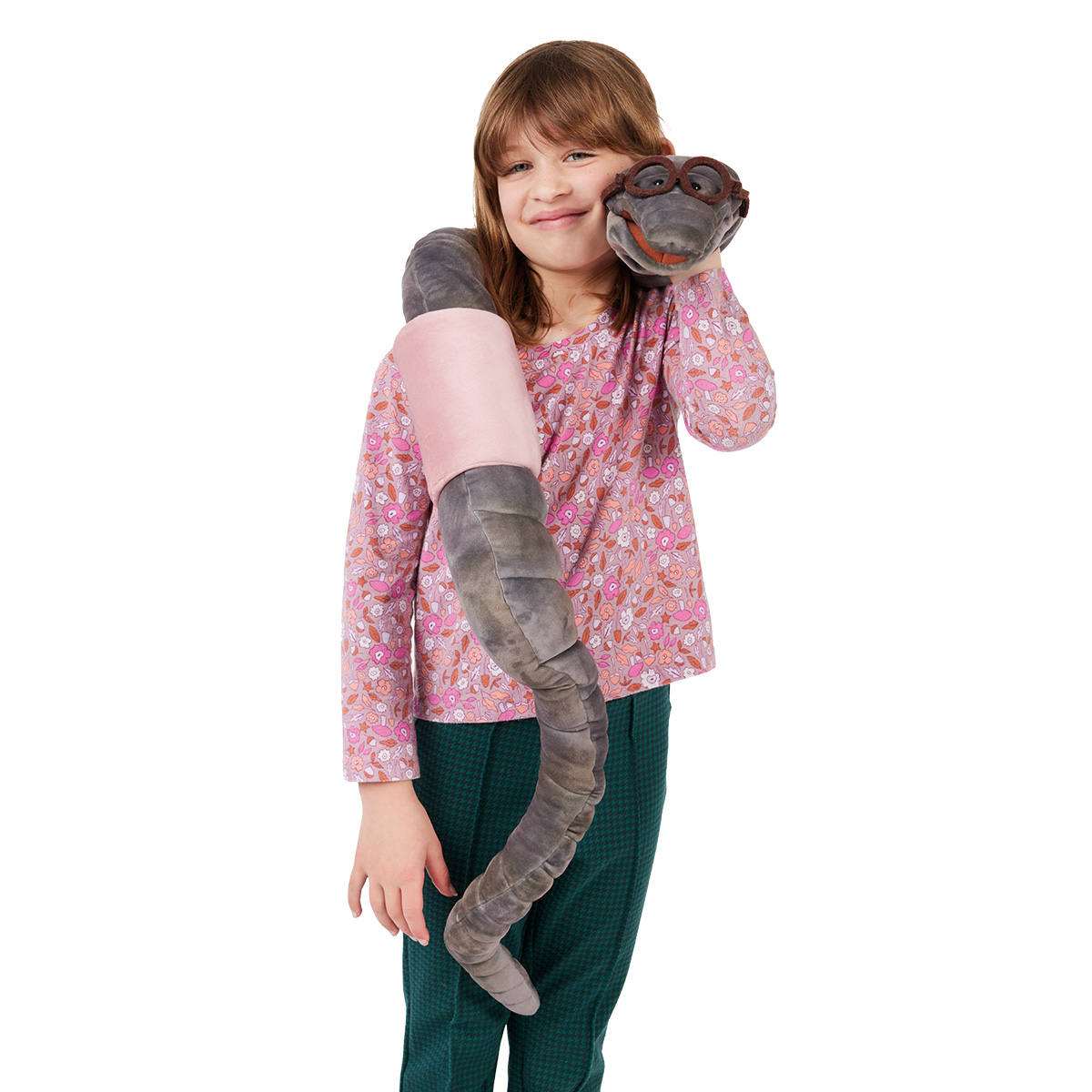 Girl holding a long grey Folkmanis bookworm hand puppet with glasses, draped over her shoulder