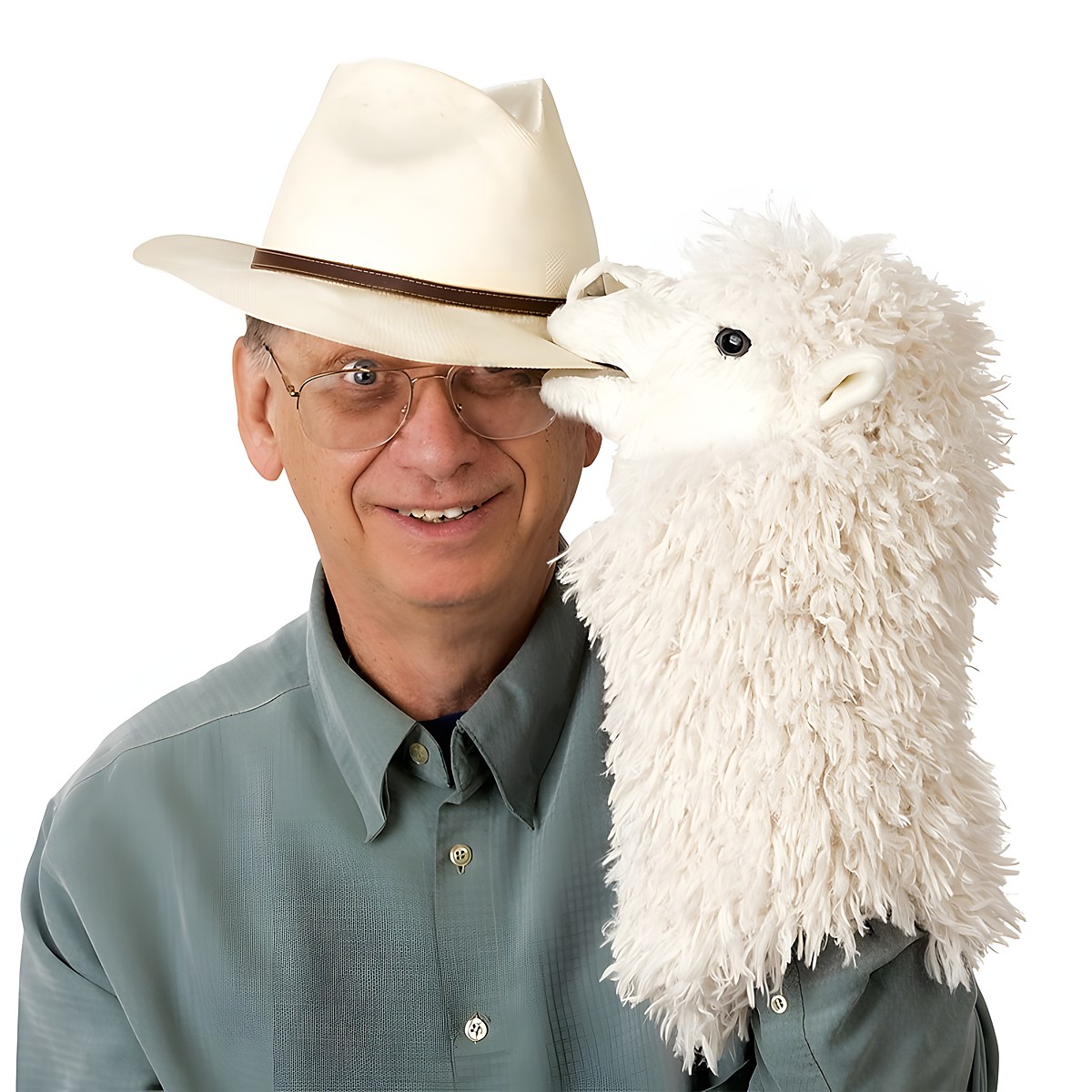 Folkmanis alpaca hand puppet with white shaggy fur playfully biting the Panama hat of a smiling man