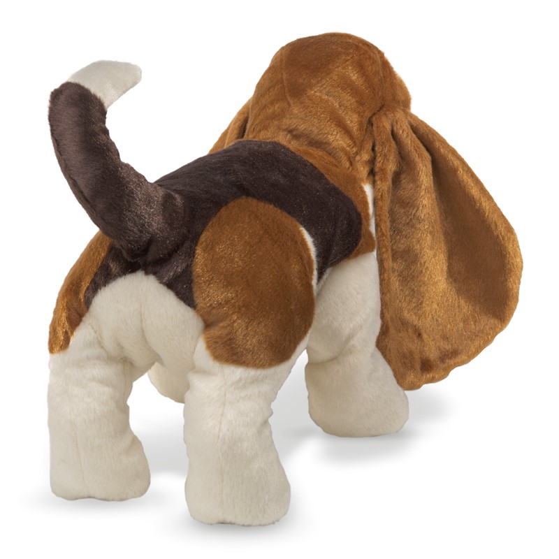 Folkmanis Basset Hound hand puppet in tricolour brown, black and white, standing seen from behind with characteristically long floppy ears