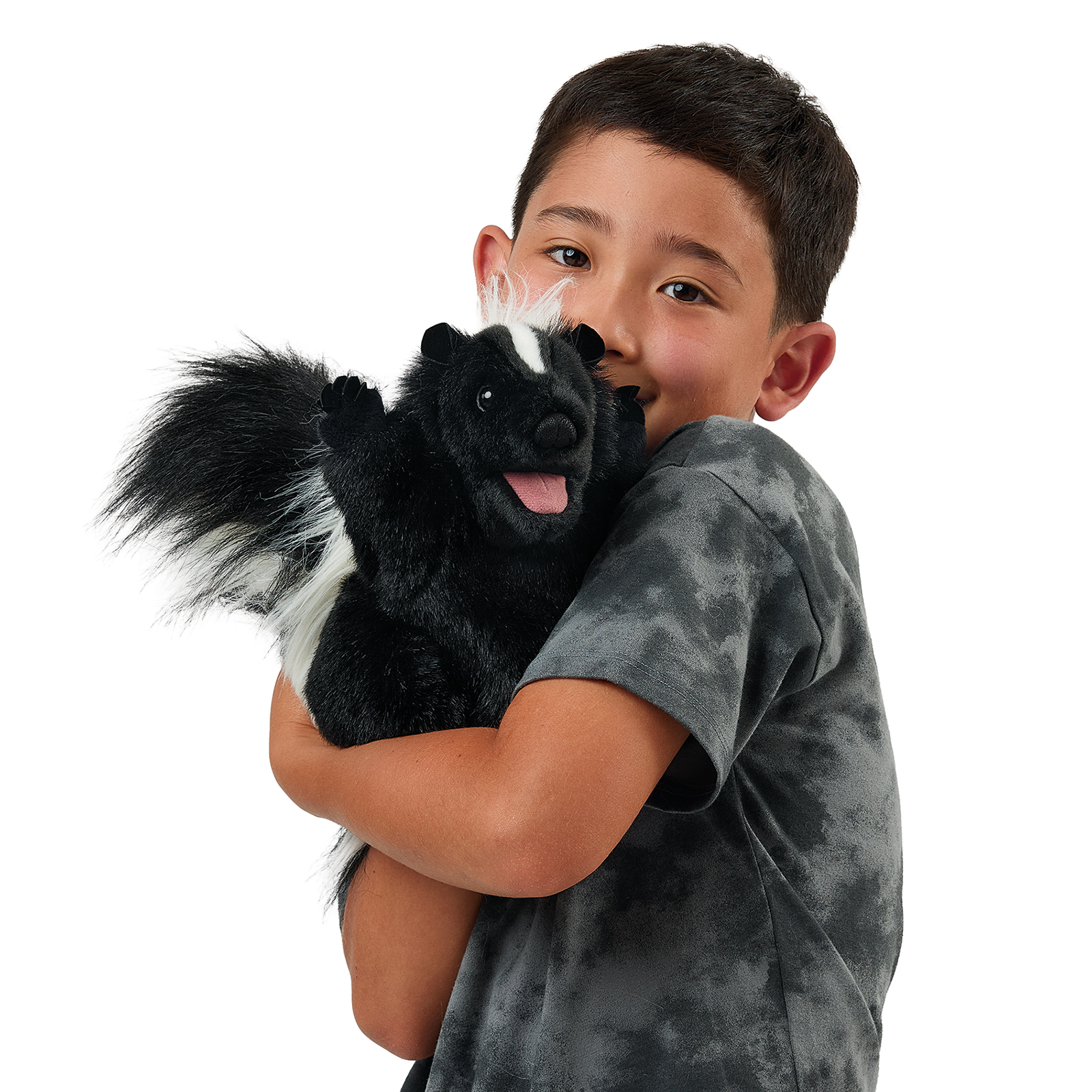 Folkmanis standing skunk hand puppet on a boy's arm, a close view with its mouth open.