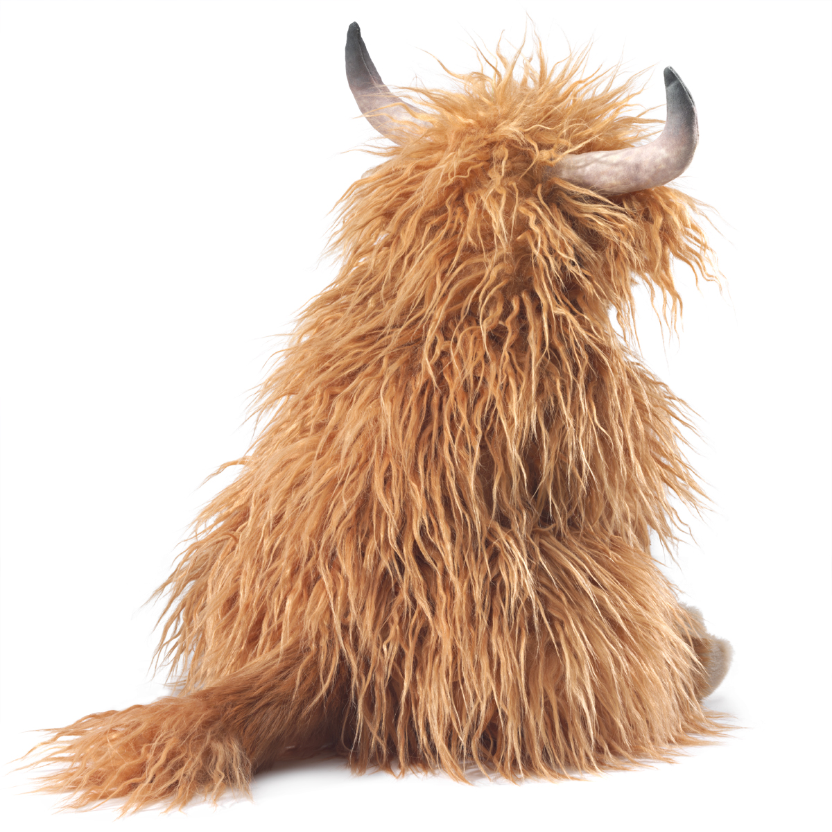 Folkmanis Highland cow hand puppet seen from behind, with long golden-brown fur and two curved grey-black horns