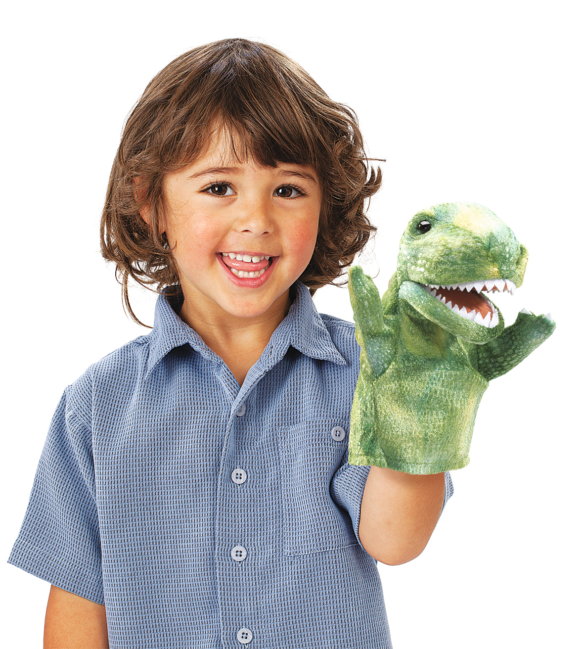 Child holding a green Folkmanis Little T-Rex hand puppet with open mouth and visible teeth up to the camera