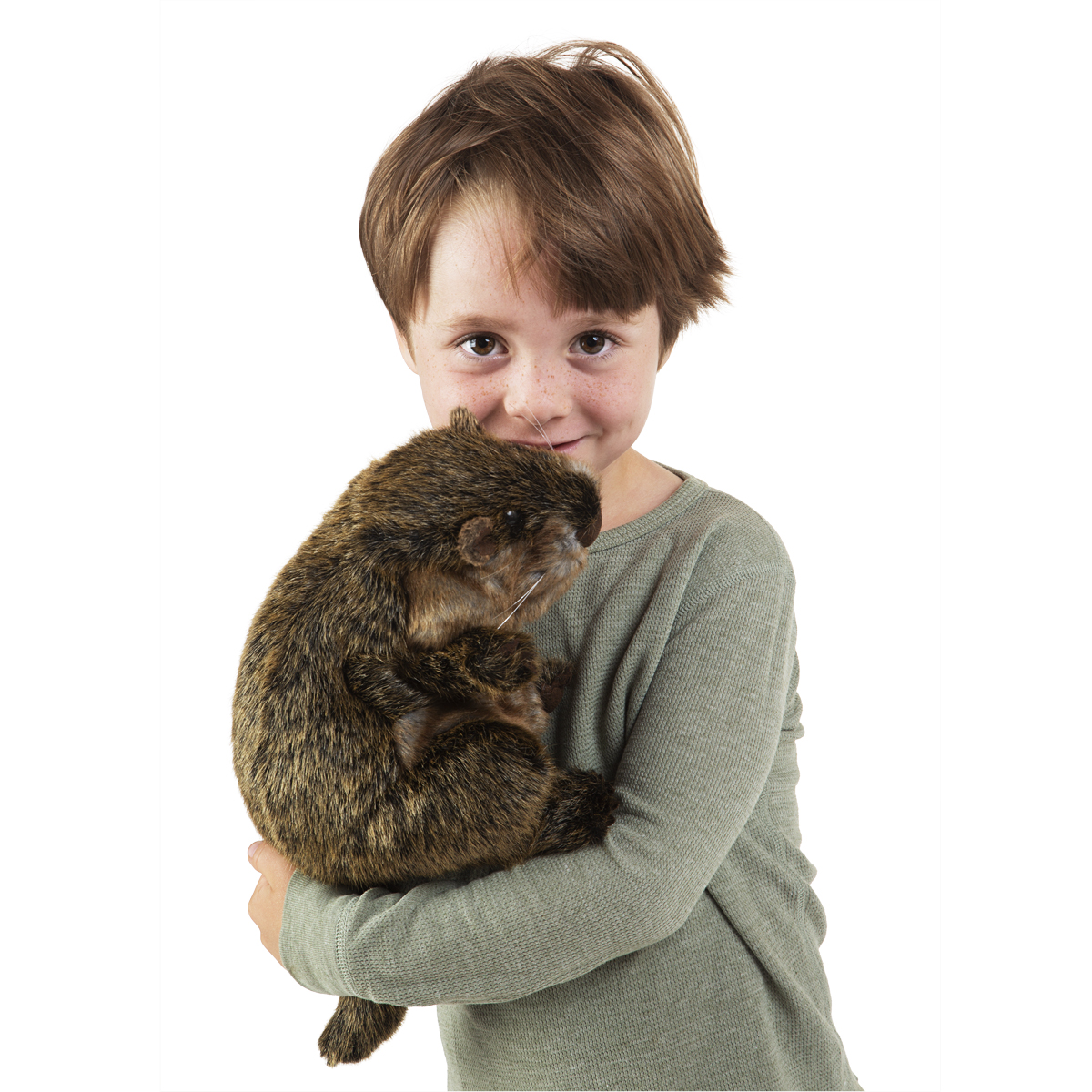 Child holding a Folkmanis groundhog hand puppet with brown faux fur and whiskers in their arms, front view