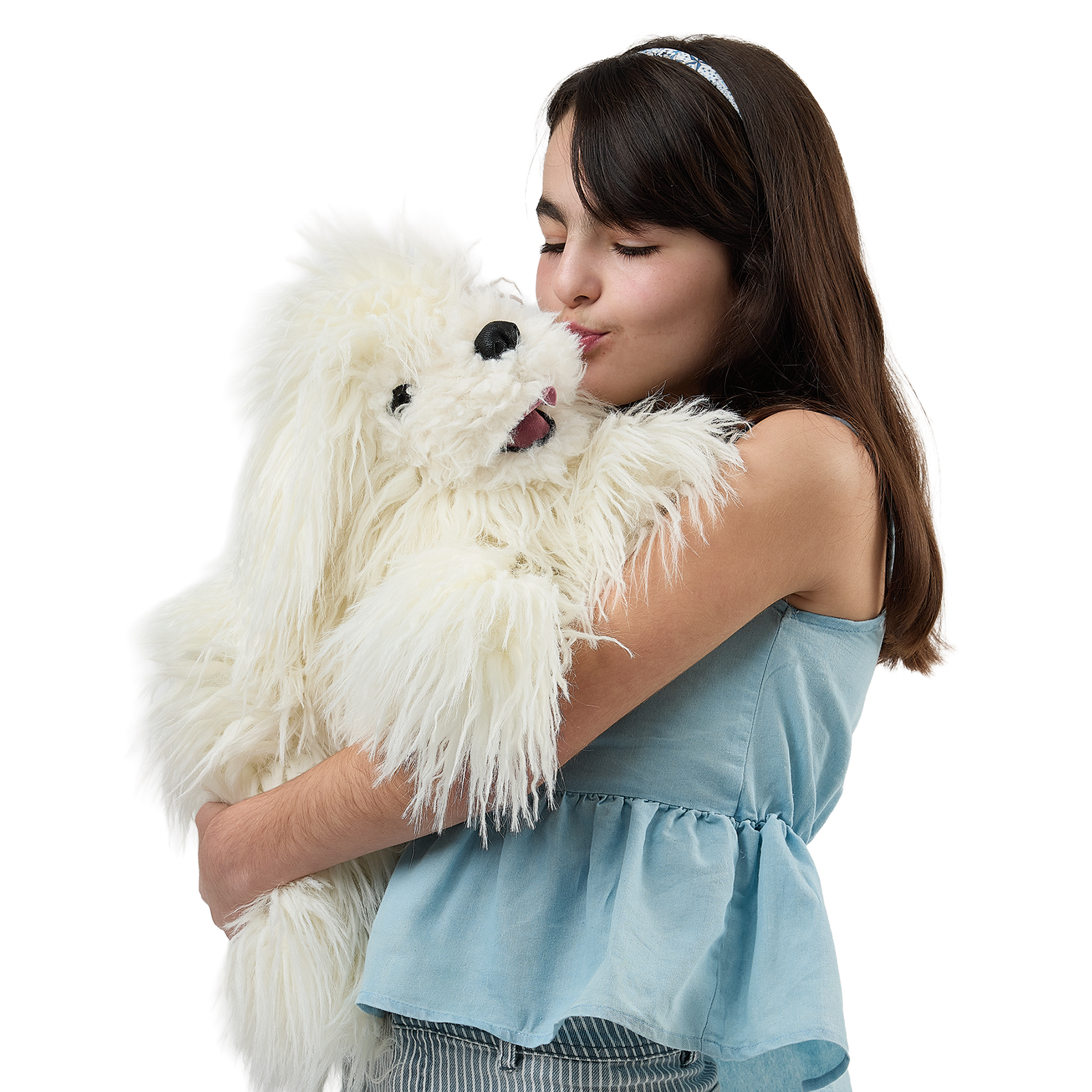 Folkmanis Komondor hand puppet on a girl's arm, held close as she touches noses with it.