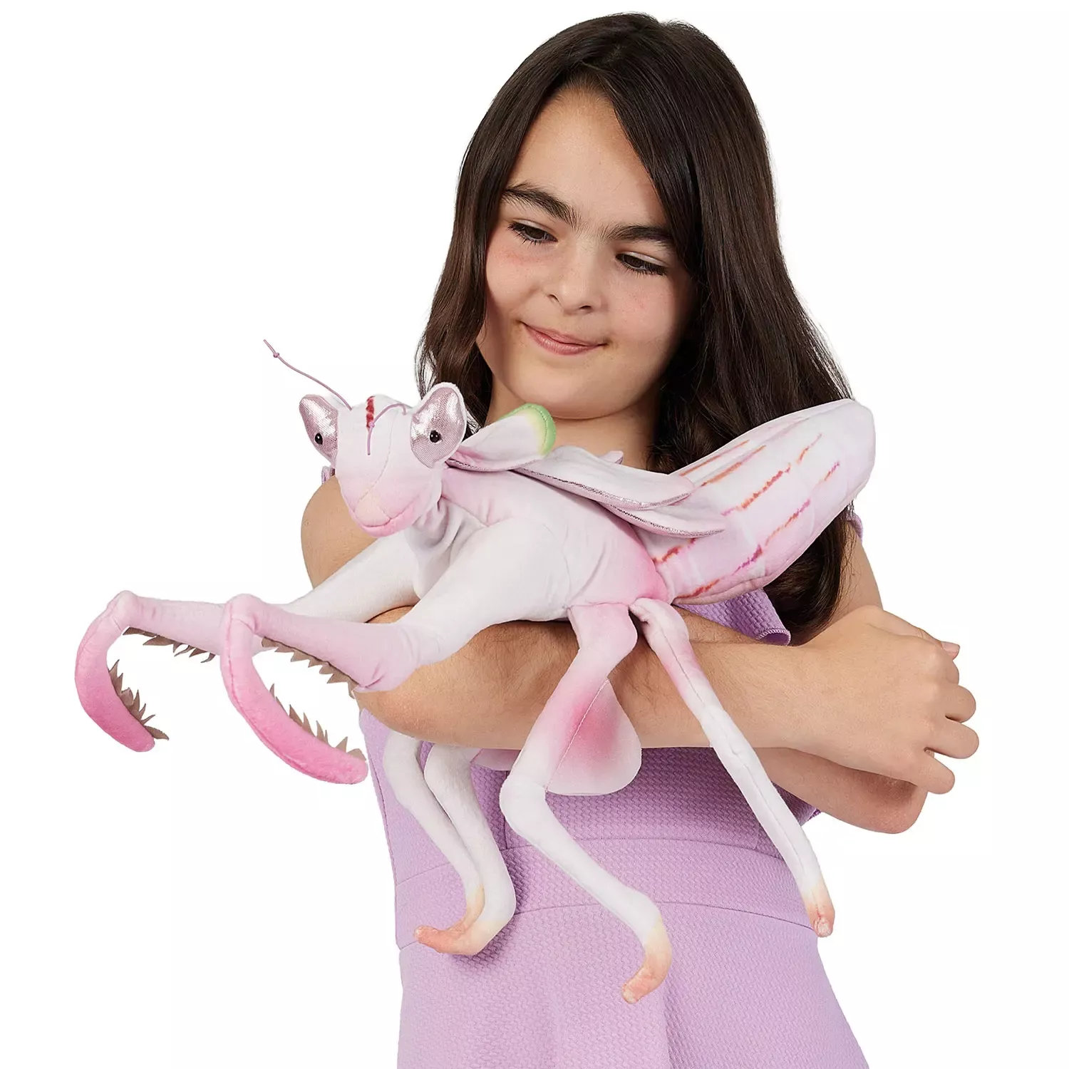 Girl holding the Folkmanis orchid mantis hand puppet in pink and white with serrated raptorial arms and wings in her arm