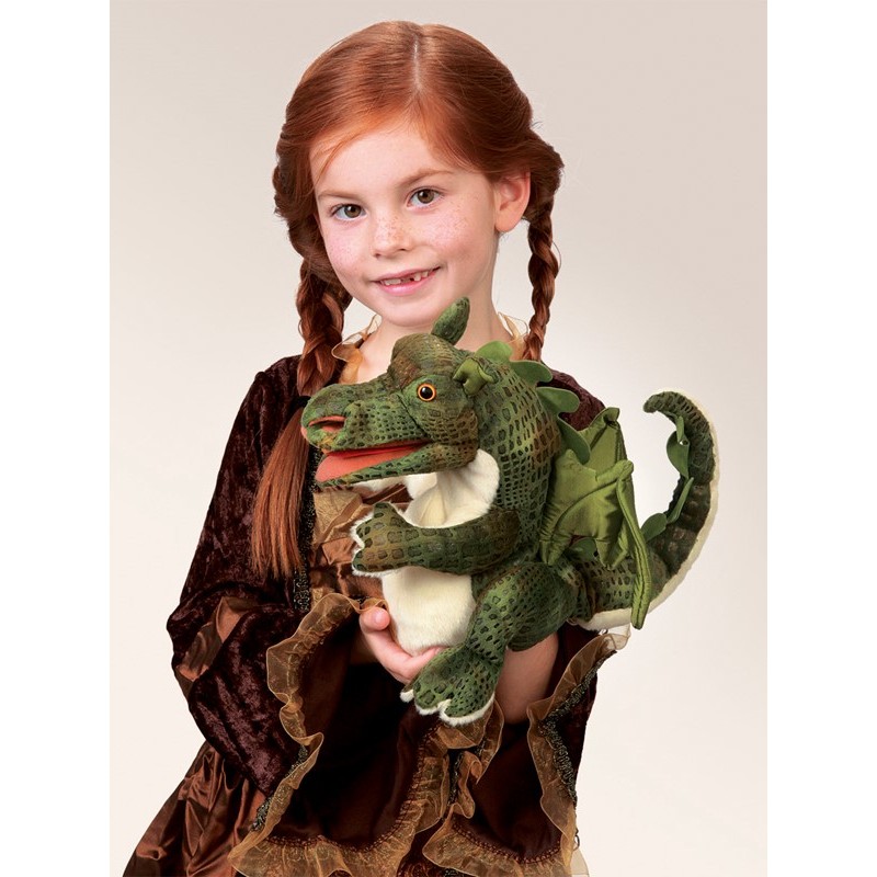 Girl holding a green Folkmanis baby dragon hand puppet with a movable mouth and wings