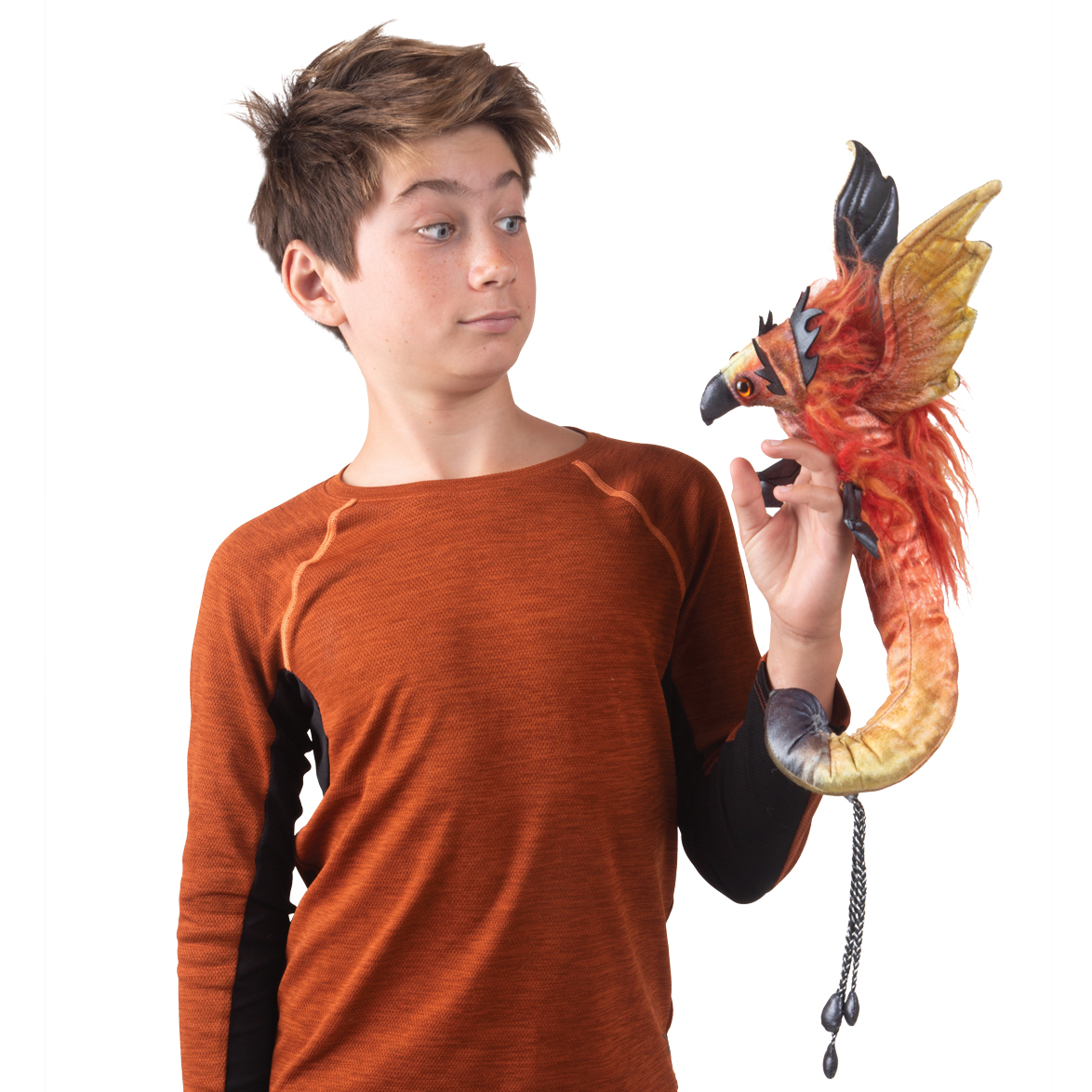 Boy holding a Folkmanis phoenix wrist puppet with red plumage, black beak, and chain bracelet on his hand