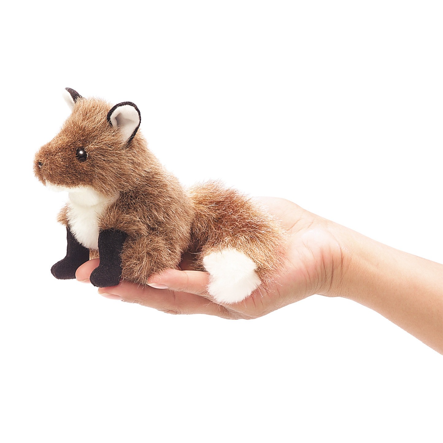Folkmanis Mini-Fingerpuppe Fuchs in Braun-Weiß-Schwarz, sitzend auf einer Handfläche, Seitenansicht