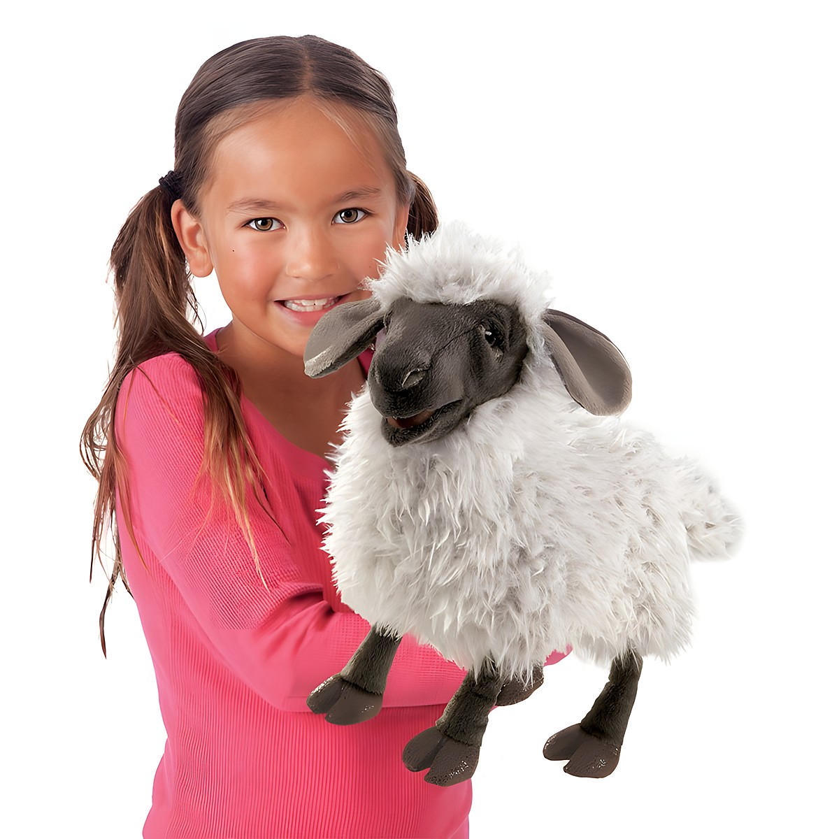 Girl holding a Folkmanis hand puppet bleating sheep with white plush fleece, dark face and movable mouth