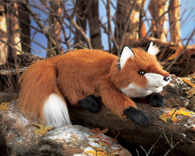 Folkmanis hand puppet small red fox in a crouching pose on a rock, red-brown fur with white tail tip and black paws