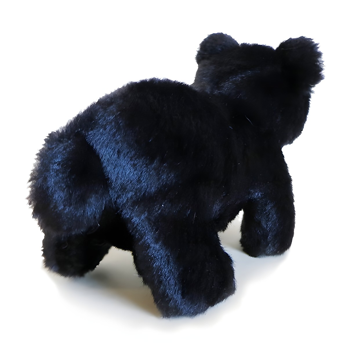 Folkmanis mini black bear finger puppet in black plush, standing shown at an angle from behind
