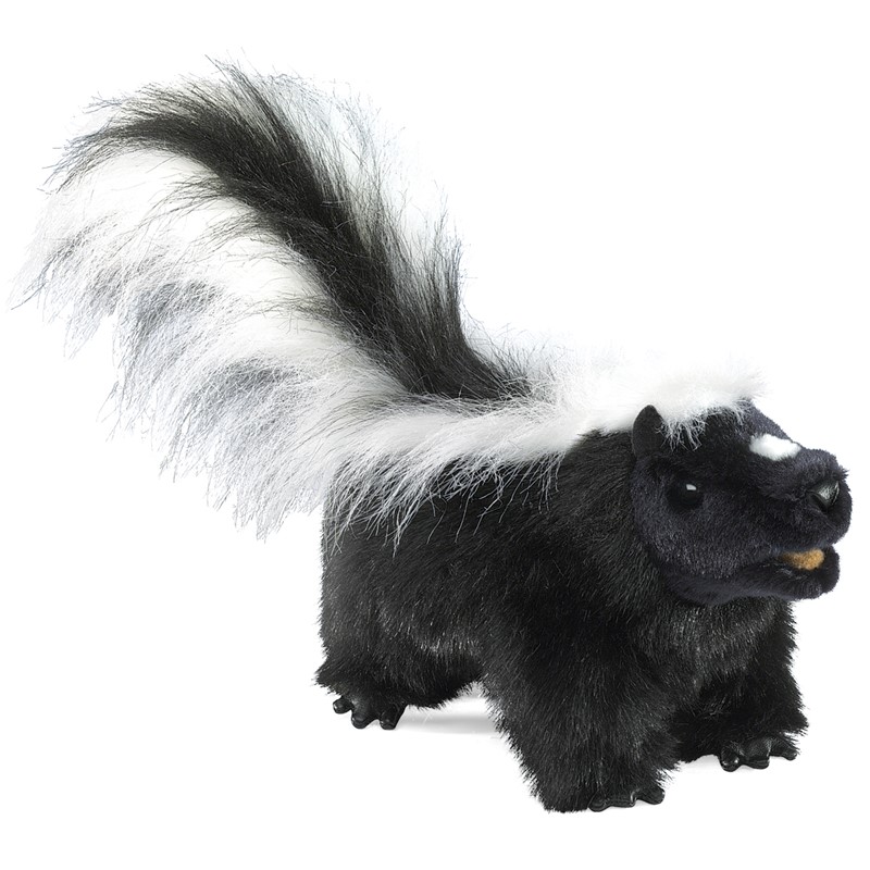 Folkmanis skunk hand puppet with black plush fur, white stripes and a bushy raised tail, shown from the side