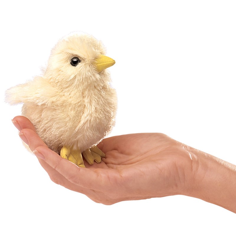 Folkmanis mini chick finger puppet in cream plush with a yellow beak, sitting on an open hand