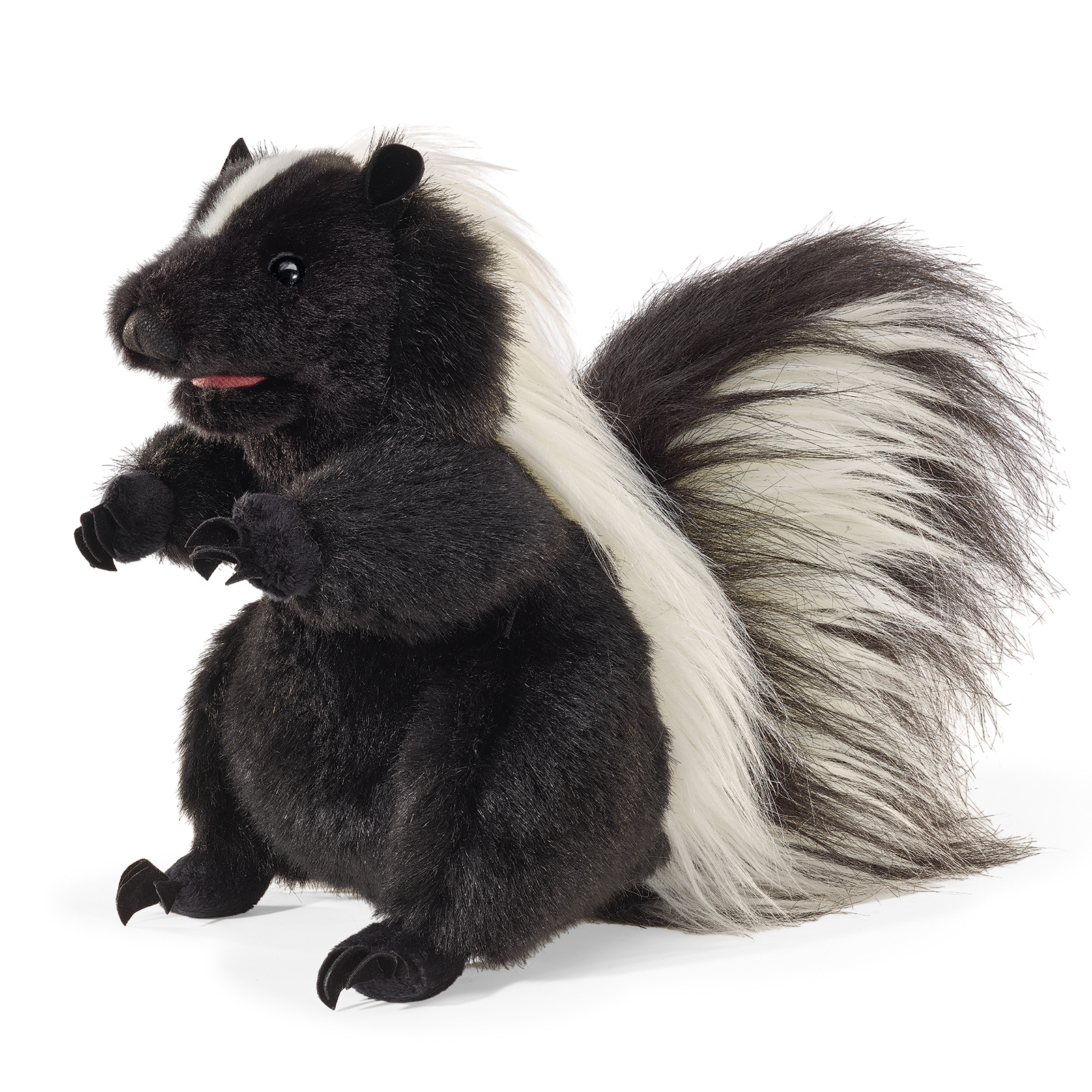 Folkmanis standing skunk hand puppet, upright in a front view with black fur, a white back stripe and its mouth open.