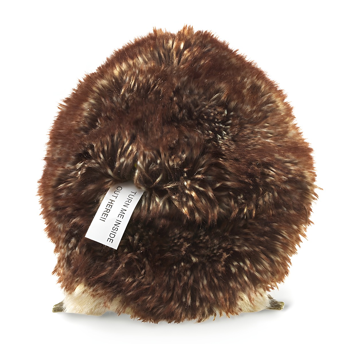 Folkmanis hedgehog hand puppet seen from behind with brown-flecked plush fur and the label reading Turn Me Inside Out Here