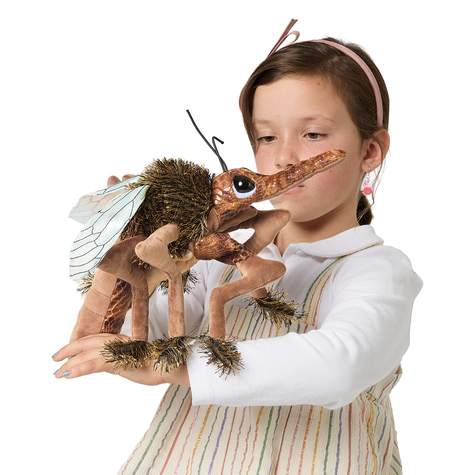 Girl holding a Folkmanis mosquito hand puppet with a long proboscis, transparent wings and a bristly brown body close to her face