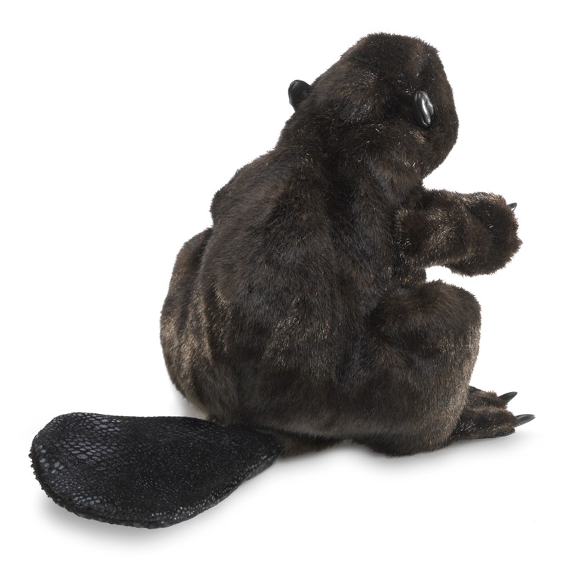 Folkmanis beaver hand puppet in dark brown plush with a textured tail, shown seated from a rear three-quarter angle