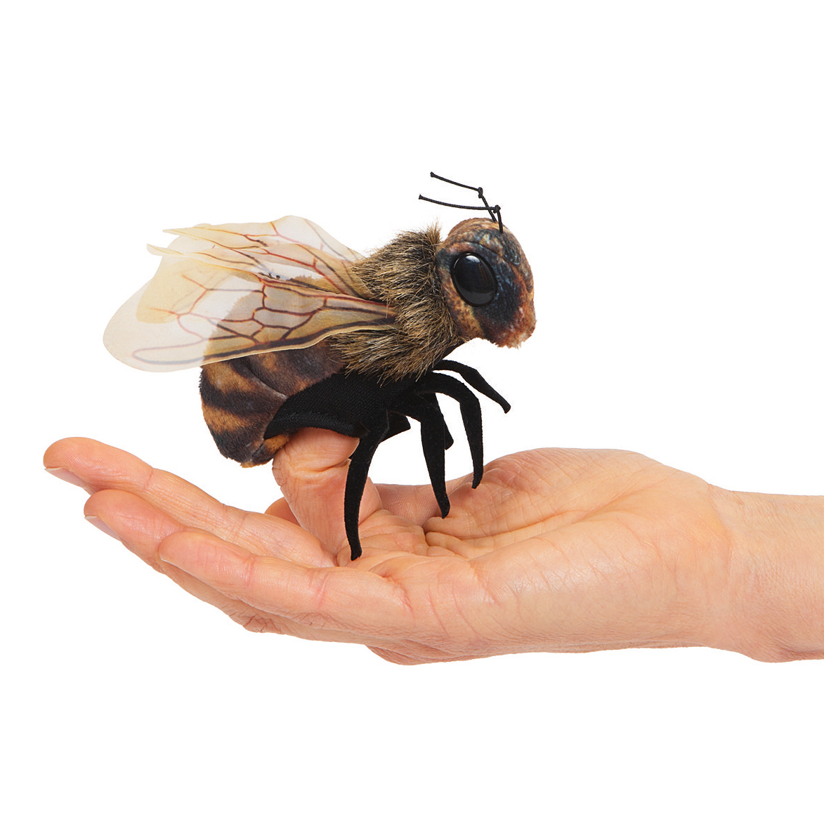 Folkmanis Mini Bee Finger Puppet with furry brown body, translucent wings and black legs, balanced on a hand
