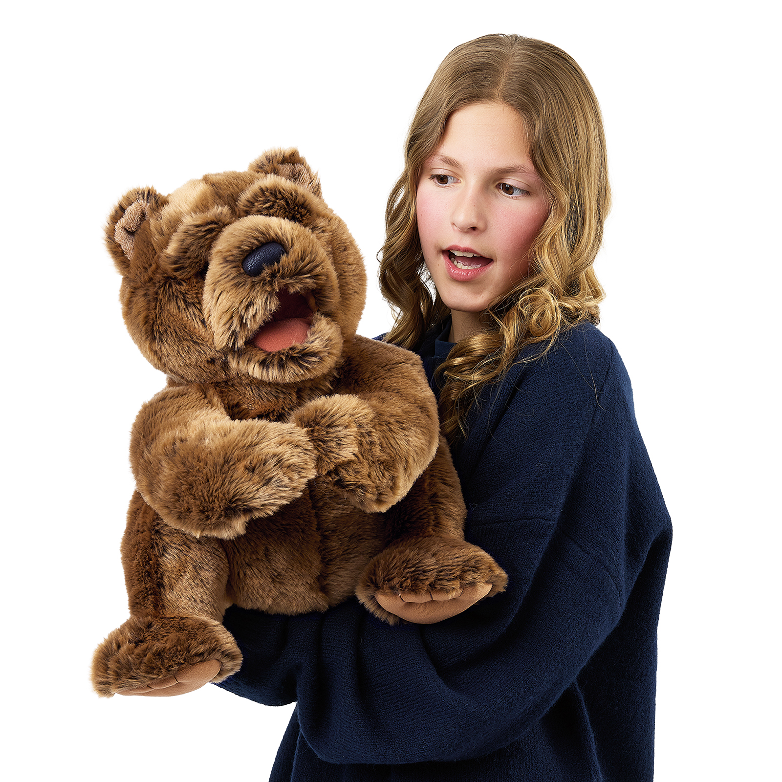 Folkmanis large bear hand puppet on a girl's arm, its mouth opened wide to show teeth and tongue.