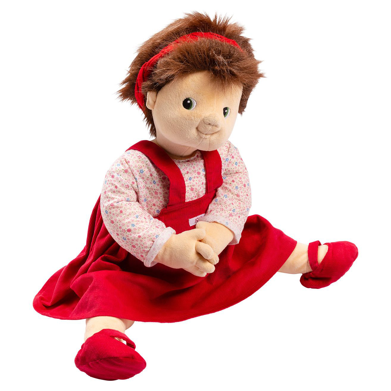 Joyk empathy doll Ingrid sitting in a red corduroy dress with red fabric shoes