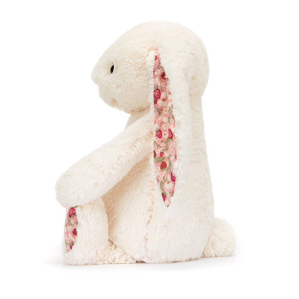 Jellycat plush toy Blossom Bunny Berry Cream, cream-coloured rabbit plush toy with pink floral-lined ear insides, side view
