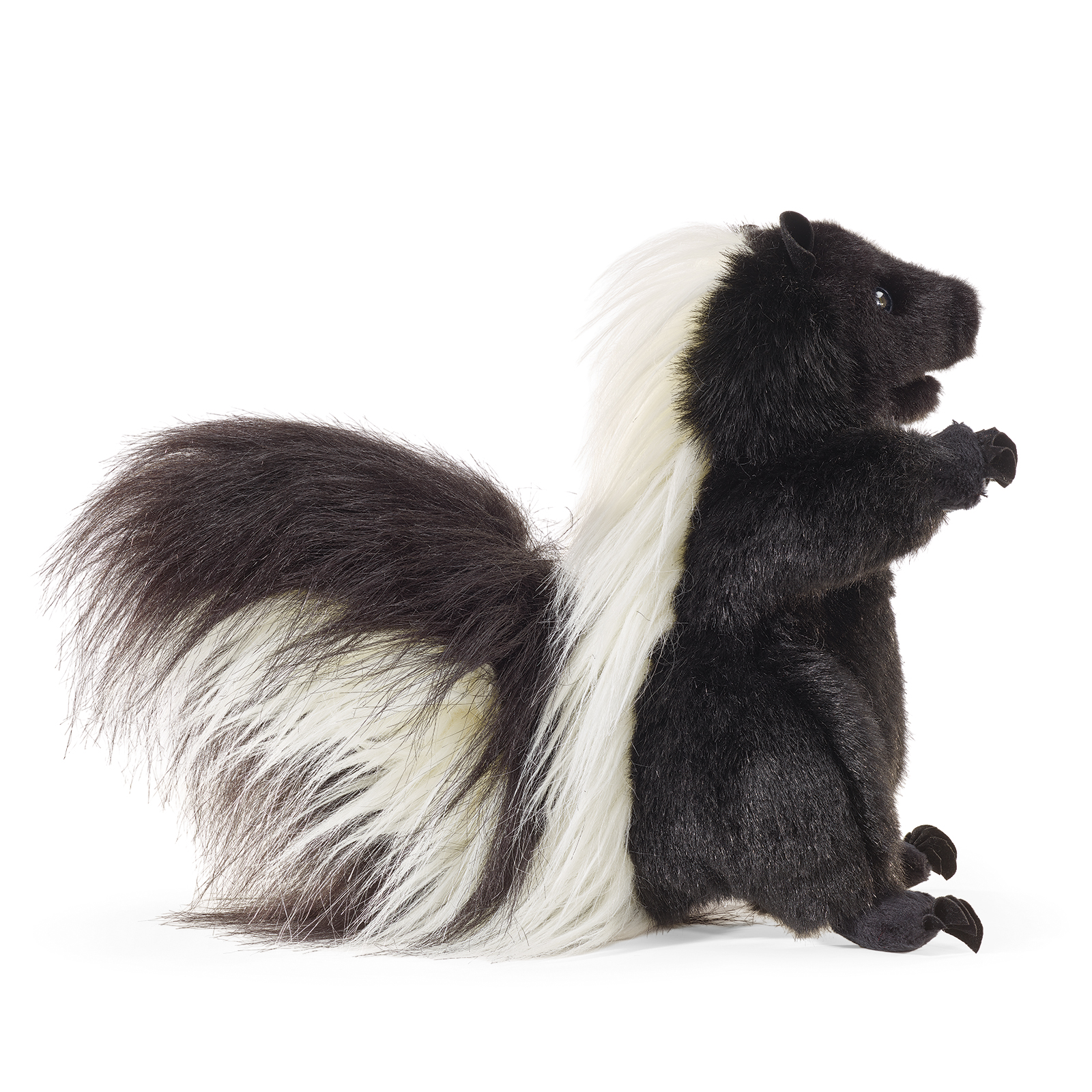 Folkmanis standing skunk hand puppet shown side-on, its bushy tail raised and the mouth closed.