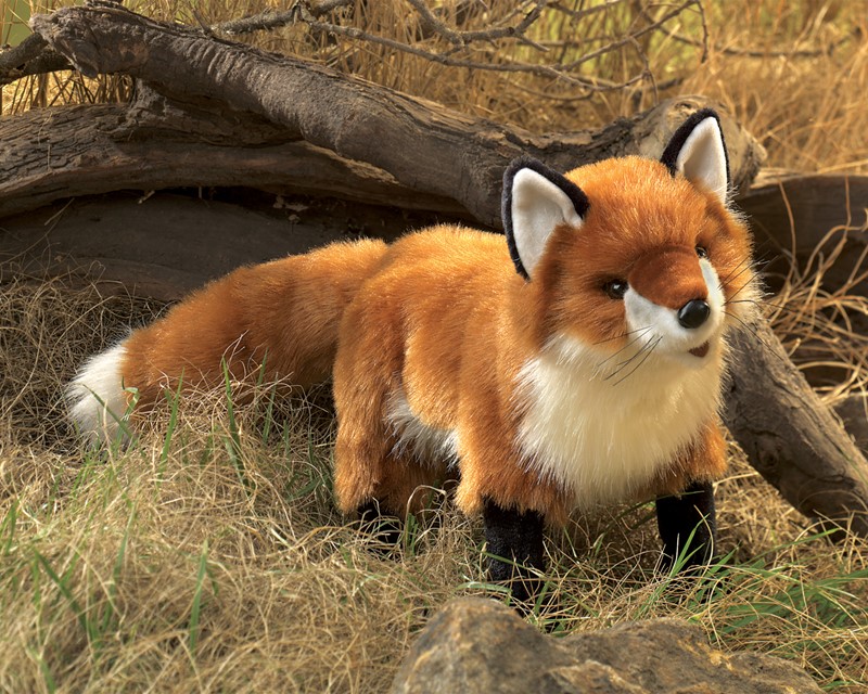 Folkmanis hand puppet large red fox with orange-brown and white fur and black paws, standing in front of roots
